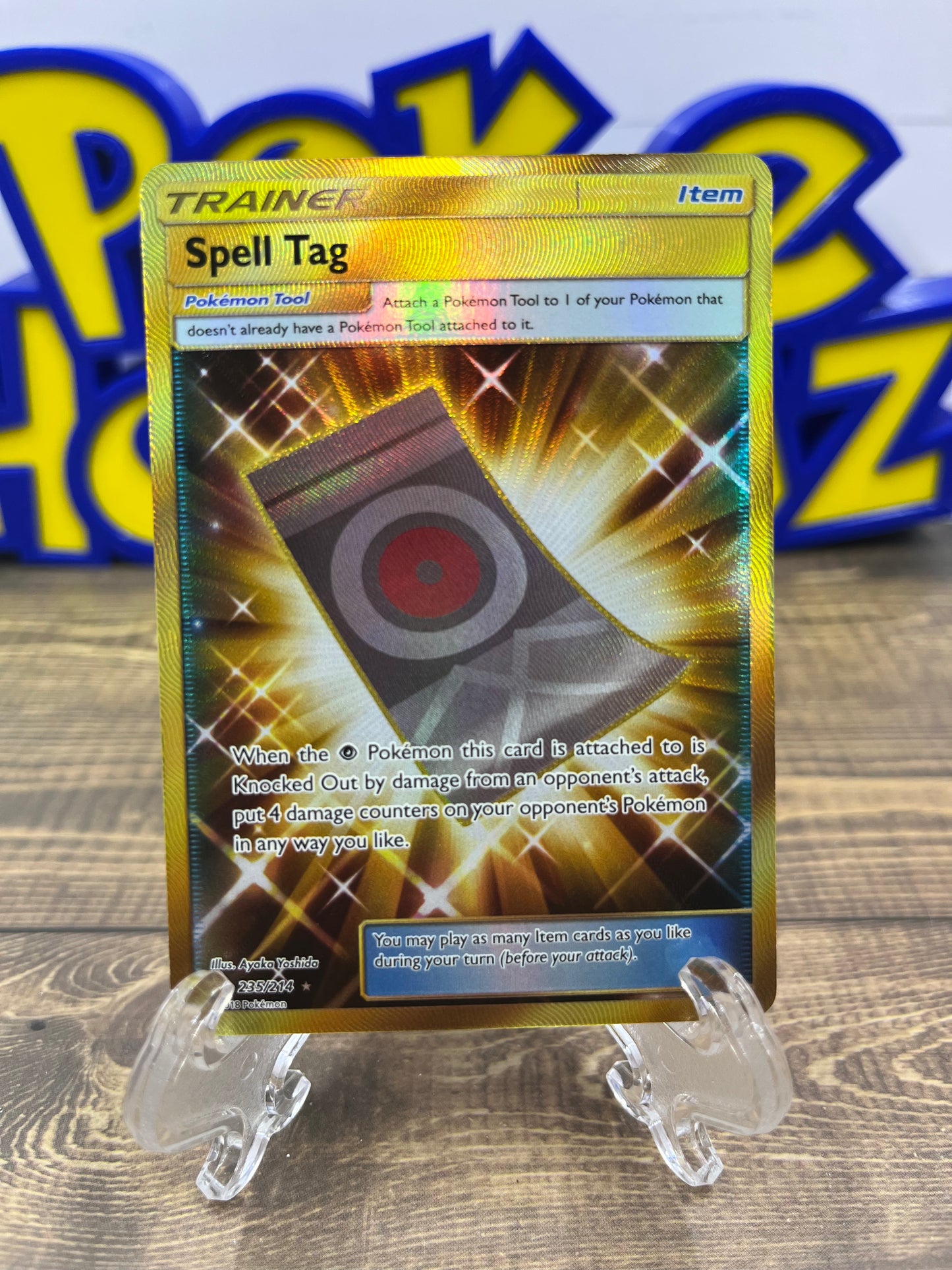Spell Tag (Gold) - 235/214